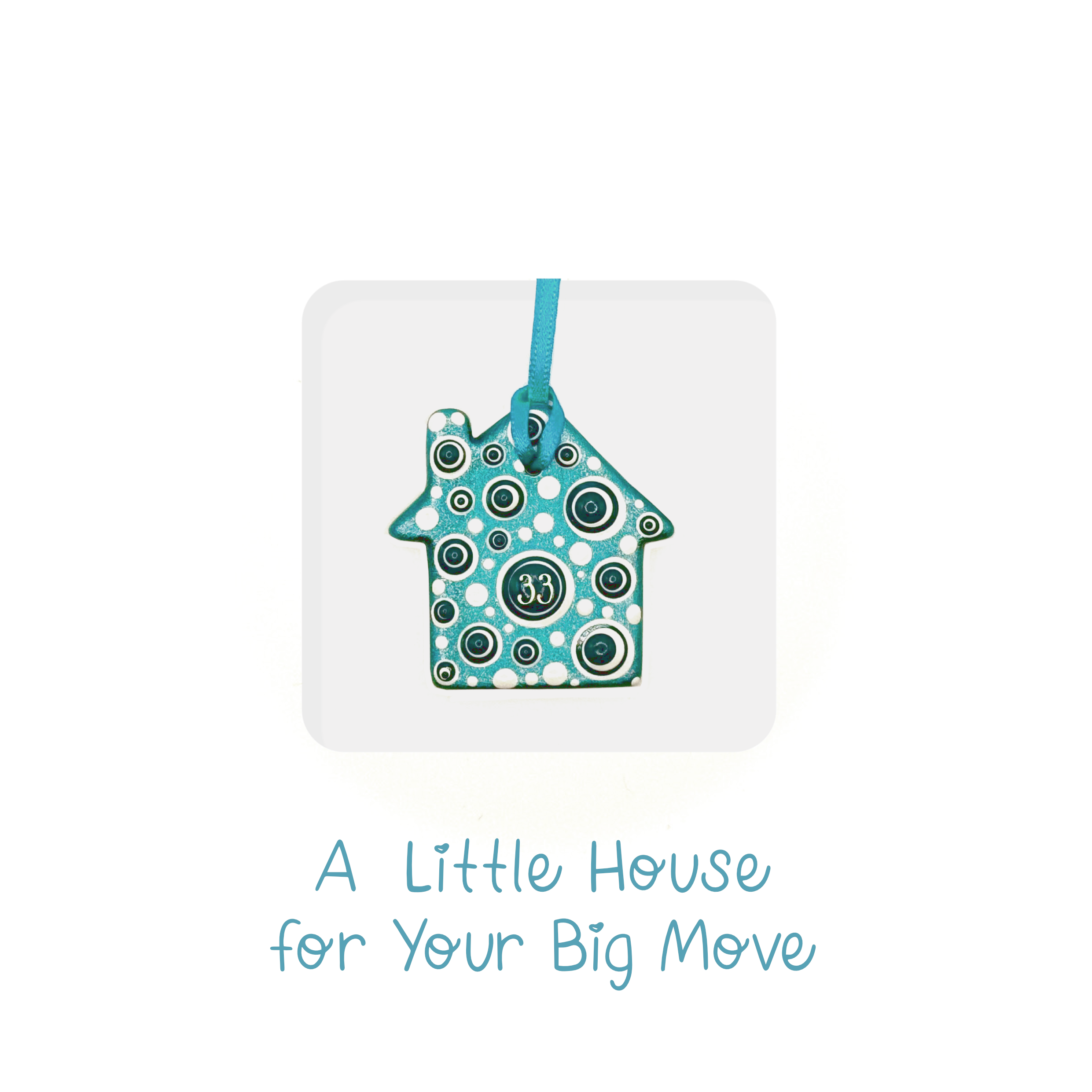 Handmade ceramic house keepsake card with blue and white circle patterns for new home gift.