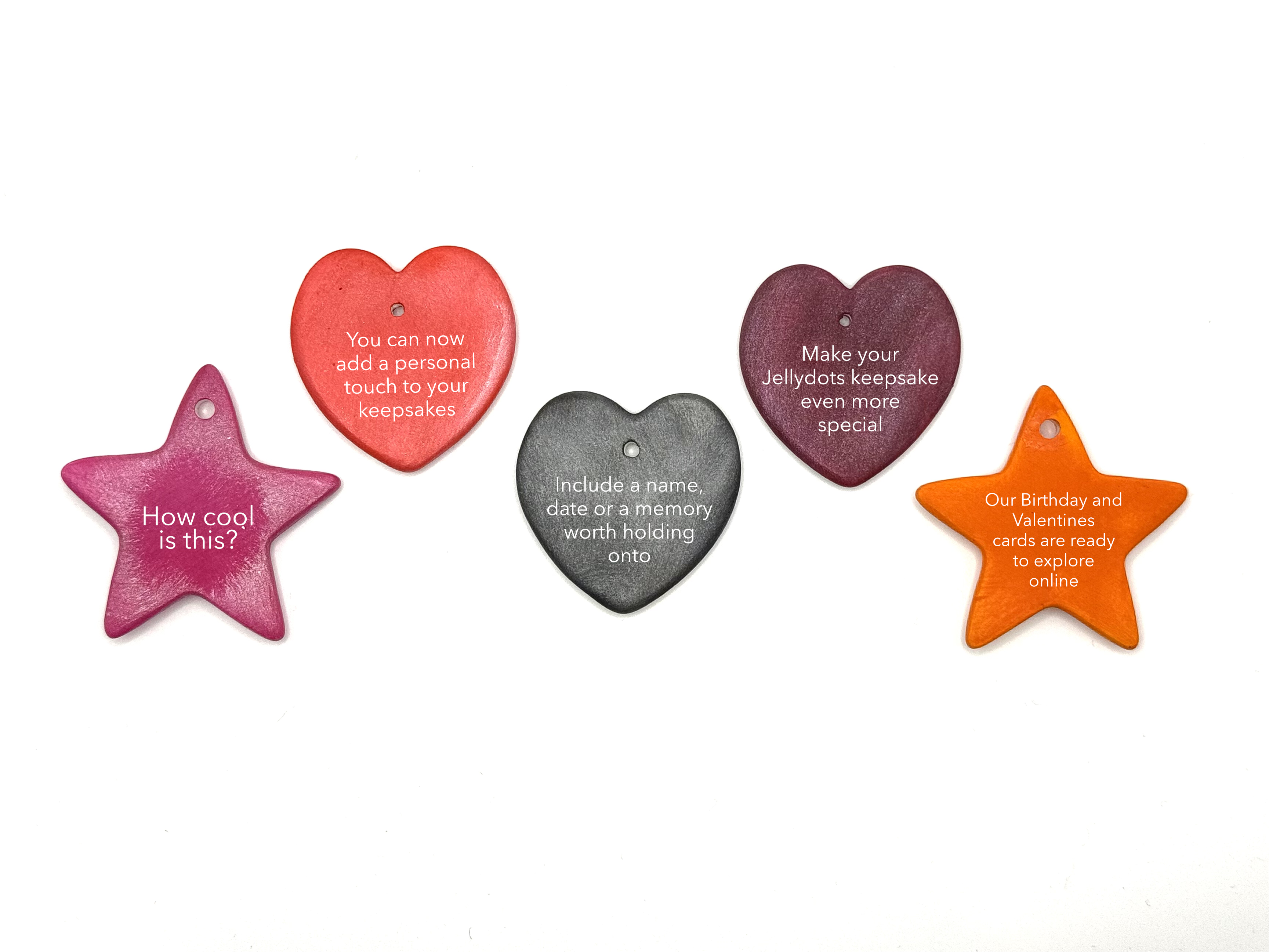 Five colorful ceramic keepsake shapes with engraved text, including stars and hearts.