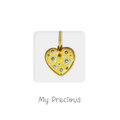 Handmade gold ceramic heart pendant with circle patterns on a keepsake card, gift for Valentine’s day