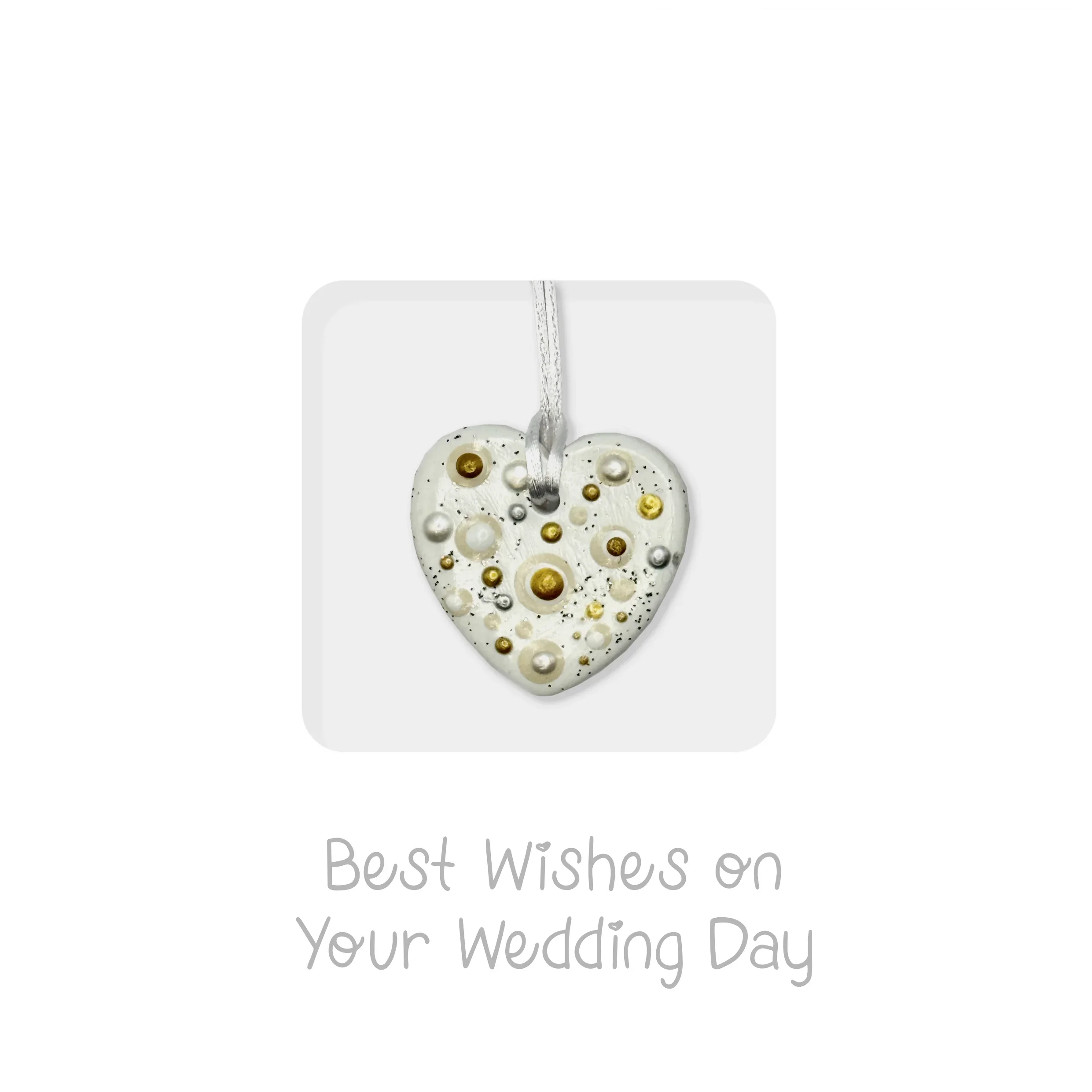 Handmade white ceramic heart keepsake with gold and pearl accents for wedding congratulations.