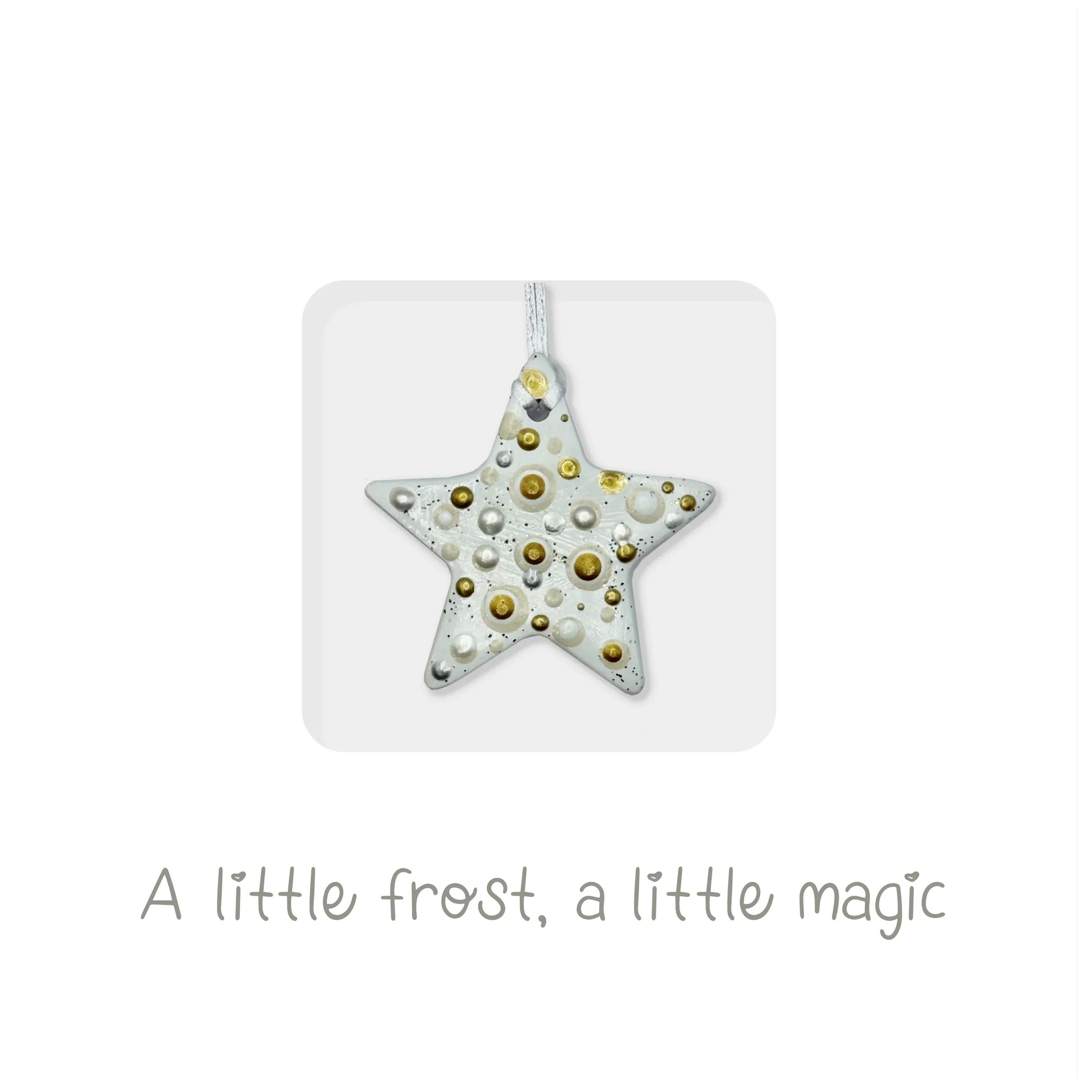 Handmade ceramic star ornament with gold and white accents, festive holiday card